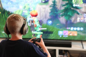 A boy playing Fortnite.