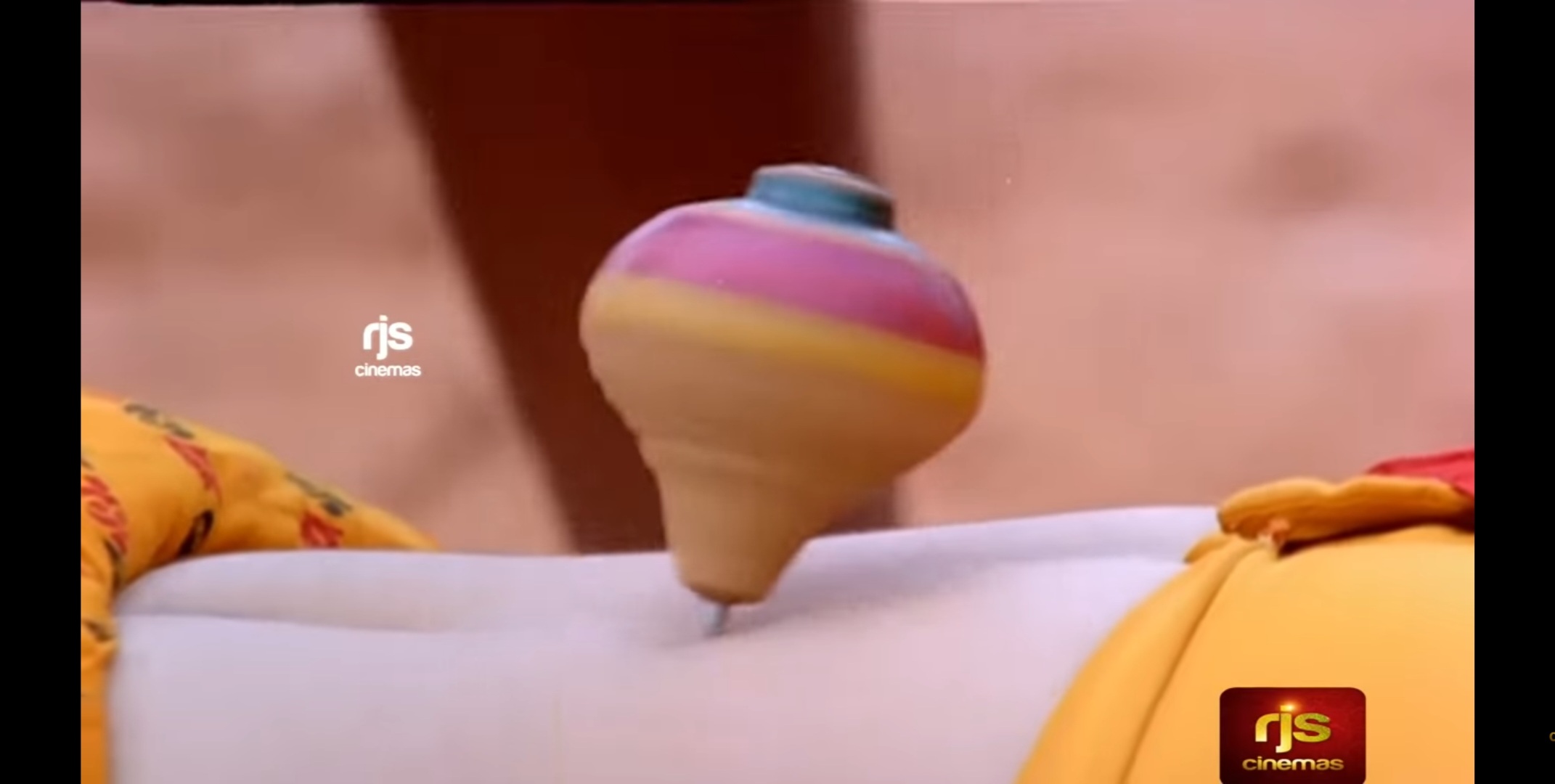A toy spins on a woman's stomach.